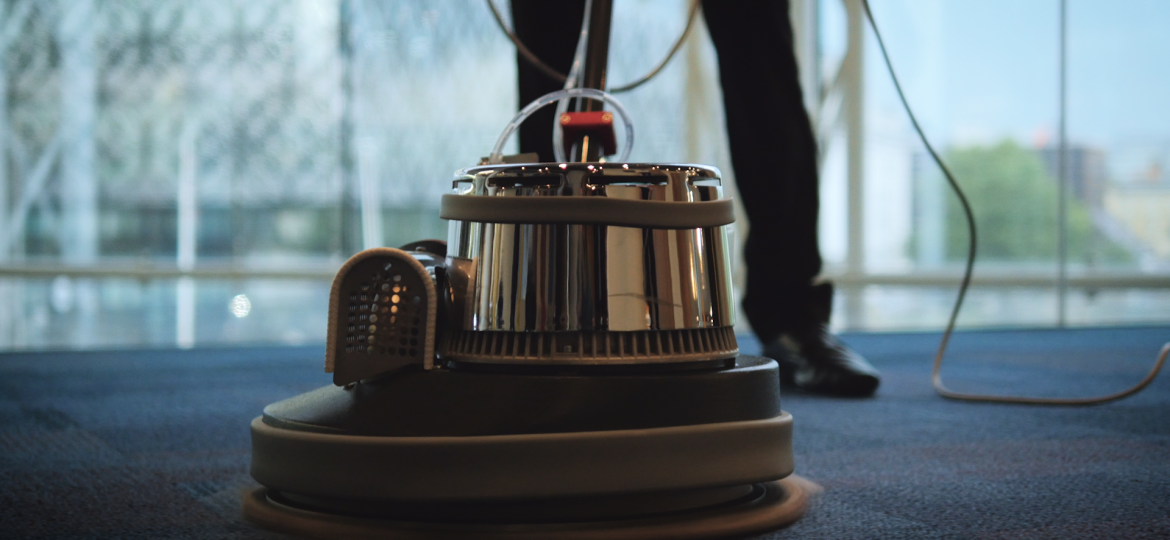 Professional office carpet cleaning machine being used to deep clean carpet in a commercial workplace.